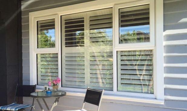 Window with plantation shutters